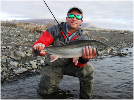 A happy angler with a Noatak River Dolly Varden.