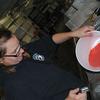Fish Technician II, Cody Block rinses Chinook salmon eggs after they were just fertilized.