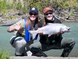 Two women with a salmon