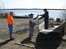 Hunters loading their boat