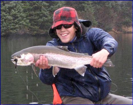 A trout angler displays his catch.