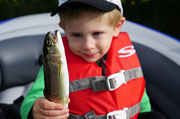 Small boy with fish
