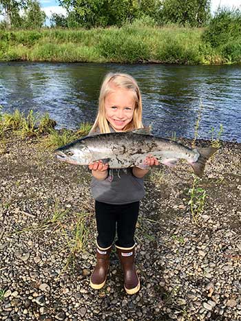 girl with coho salmon