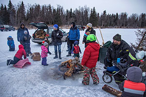 Gather around a fire on the ice