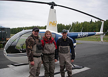 Photo of staff with a helicopter