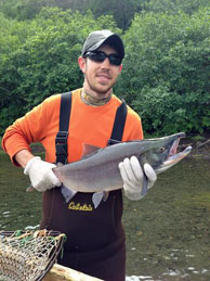 Photo of Adam Edge with salmon