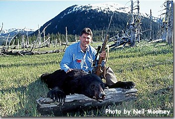 Successful hunter with black bear