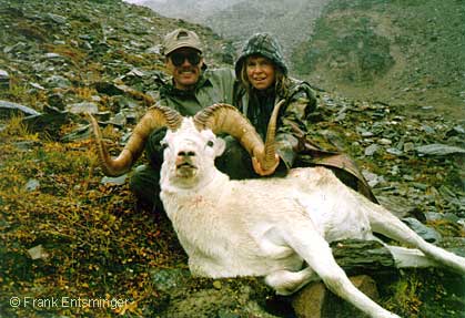 Two successful hunters with their goat.