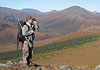 Hunter looking through binoculars