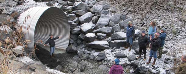 workshop attendees examine a culvert