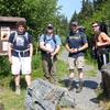 Hatchery personnel pose for a quick photo before backpacking rainbow trout fingerling into a lake without motorized access.