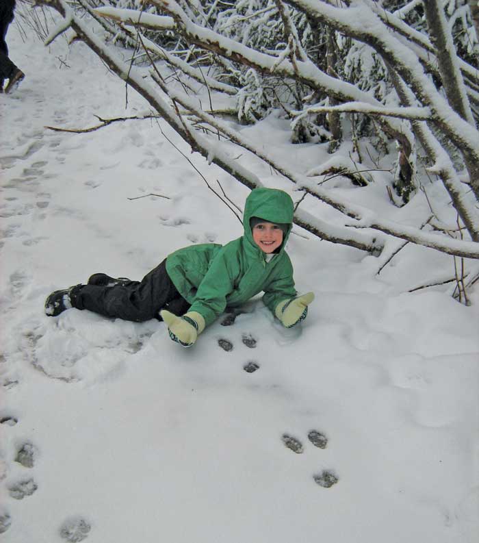 Picture of child and tracks in snow - Alaska Department of Fish and Game (ADFG)