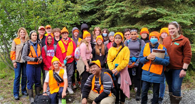 Group of HIT program participants posing outdoors