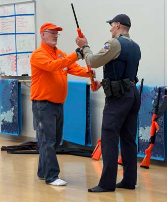 Employee demonstrates careful firearm handling