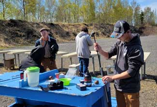Hunters preparing a gun