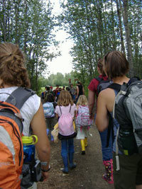 Group of people walking through the woods