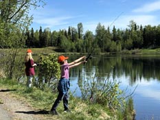 Students fishing at lake