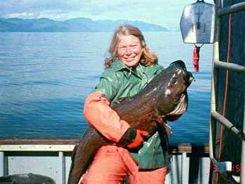 Researcher holding a sablefish.