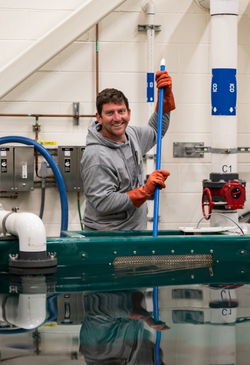 Staff cleaning the char tanks