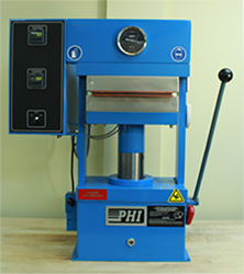 Example hydraulic press used to apply pressure and heat to scales on gummed cards.