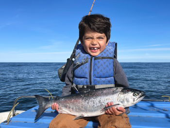 kid with fish - Alaska Department of Fish and Game (ADFG)