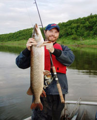 fisherman with pike